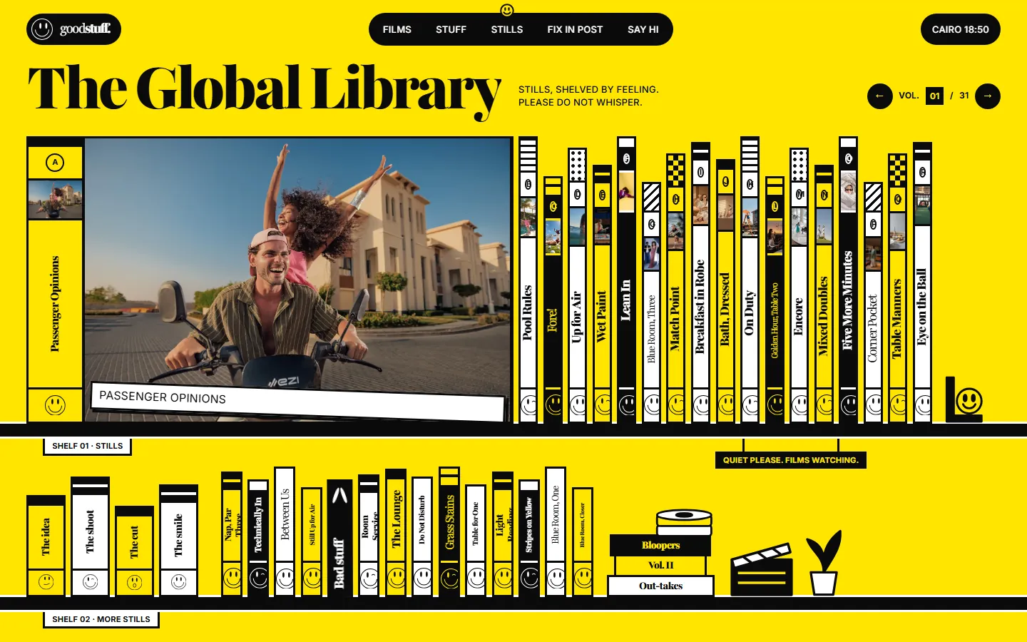 The Global Library: stills shelved as titled book spines, one pulled out and shown large